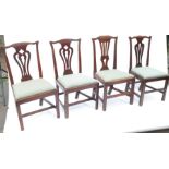 Four country Chippendale style dining chairs, with variations of vase splat back, drop-in seats