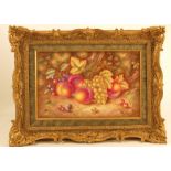 A Royal Worcester limited edition set of three framed porcelain plaques, painted with fruit to a