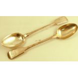 A pair of Georgian silver fiddle pattern serving spoons, monogrammed with a crest, London 1831,
