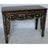 An oriental hardwood altar table, of rectangular form, the front with pierced and inlaid mother of