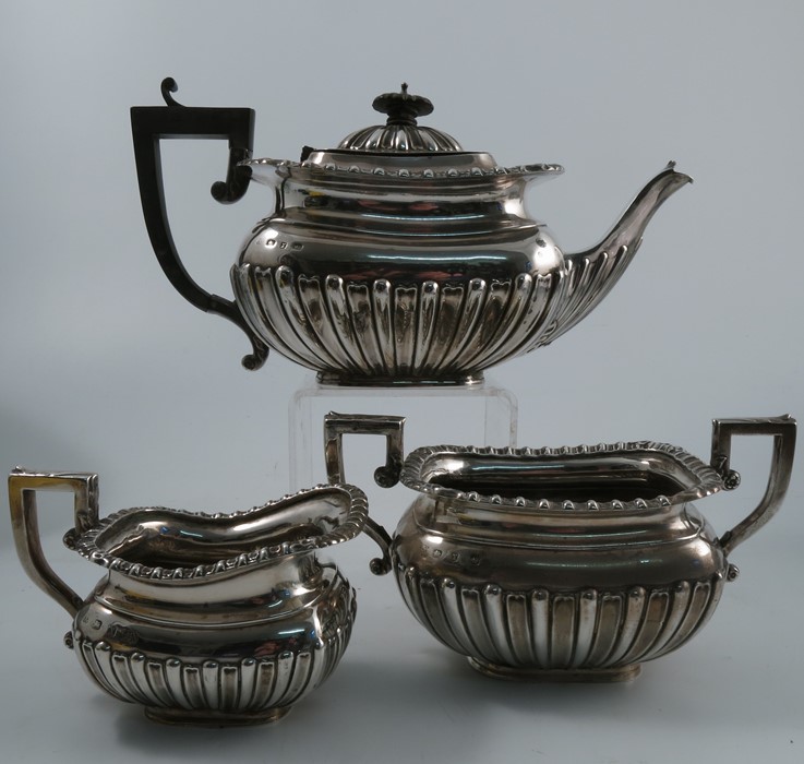 A silver three piece tea set, with gadrooned border and lower body, Birmingham 1897, weight 29oz all