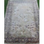 An Eastern style silk rug, decorated with a tree and birds, 68ins x 47ins