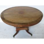 A 19th century rosewood and inlaid cut brass breakfast table, of circular form, the tilt top