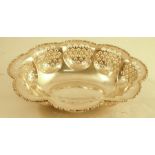 A silver shaped oval bowl, with embossed edged and pierced decoration, Birmingham 1930, weight 8oz