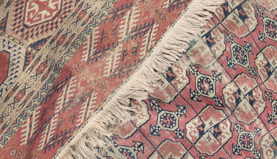 An Eastern style rug, decorated with repeating motifs to the field and hooked gulls to the - Image 4 of 4