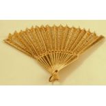 A carved bone fan, with lace and sequin decoration, af