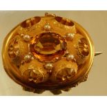 A Victorian citrine and pearl gold brooch, the oval cut with pearl points (untested and unwarranted)