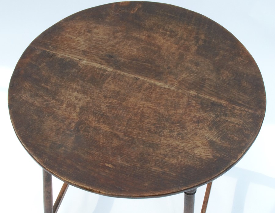 A circular oak occasional table, raised on four turned legs, united by a stretch, diameter 21ins, - Image 2 of 2