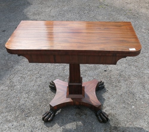 A 19th century rosewood fold over card table, raised on a turned column, on a base with claw feet, - Image 2 of 4