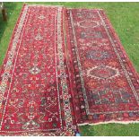 Two Eastern style runners, decorated with hooked motifs to the fields, 115ins x 31ins and 103ins x