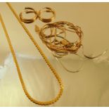 A collection of 9 carat gold chains together with a pair of hoop earrings, 9.8g gross