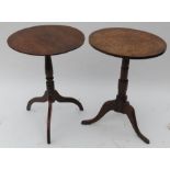 Two antique oak tripod occasional tables, with circular tops, raised on turned columns with three