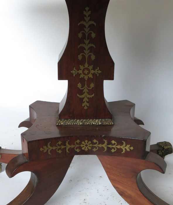 A 19th century rosewood and cut brass fold over games table, raised on an inlaid column to a - Image 3 of 3