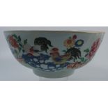 An 18th/19th century Chinese export punch bowl, the exterior decorated in polychrome colours with