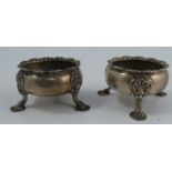 A pair of Georgian silver open salts, with gadrooned edge, both engraved with an H and raised on