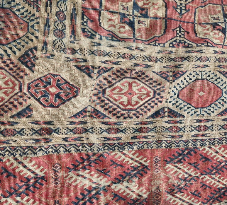 An Eastern style rug, decorated with repeating motifs to the field and hooked gulls to the - Image 3 of 4