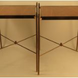 A pair of mahogany and brass tables, of square form, with brass edge and raised on brass legs with