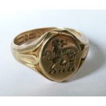 A 9 carat gold crested signet ring, finger size K, 4.4g grossCondition Report: Good condition