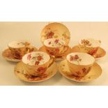 Five Royal Worcester blush ivory tea cups and saucers, decorated with floral sprays, together with