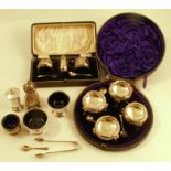 A cased hallmarked silver three piece condiment set, together with various hallmarked silver