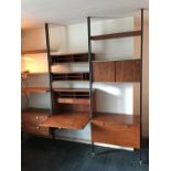 A 1960's wall unit, veneered in oiled walnut, Comprehensive Storage System, retailed by Hille of