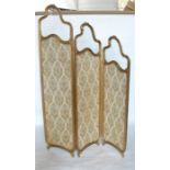 An Edwardian three fold screen, each graduated panel having a gilt frame with glazed upper section