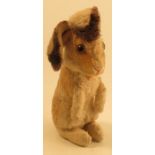 A Steiff plush rabbit, with button to ear, height 11ins