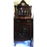 A late 19th century mahogany music cabinet, with mirrored shelf over, with drawer and carved