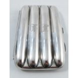 A silver cigar case, holding four cigars, engraved with initials, Birmingham 1911, weight 5oz, 5.