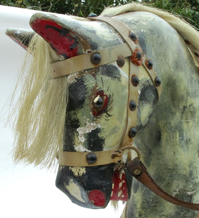 An Edwardian rocking horse, painted in dapple grey, with saddle and bridle, on a beech wood base, - Image 2 of 2