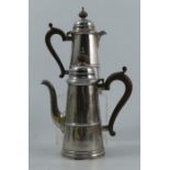 A silver coffee pot, together with matching hot water jug, with tapered ribbed body, Birmingham