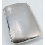 A silver cigarette case, of rectangular form, with engine turned decoration, Birmingham 1936, weight