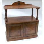 An Arts and Crafts style pollard oak buffet, having carved decoration to the supastructure, over two