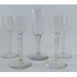A set of four cordial glasses, with faceted lower bowl and stem, height 6ins, together with