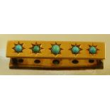 A Victorian five stone turquoise gold panel brooch, unmarked, 4.7cm long, 8g gross