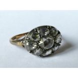 An early 19th century nine stone rose diamond cluster ring, to an unmarked gold mount with