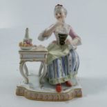 A 19th century Meissen figure, Taste, from the Five Senses group, after the model by J.C. Schönheit,