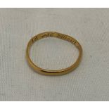 A late 17th century gold posy ring, makers mark MN conjoined, with engraved rhyme 'God did decree