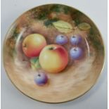 A Royal Worcester circular dish, decorated with fruit to a mossy background by Roberts, diameter 4.