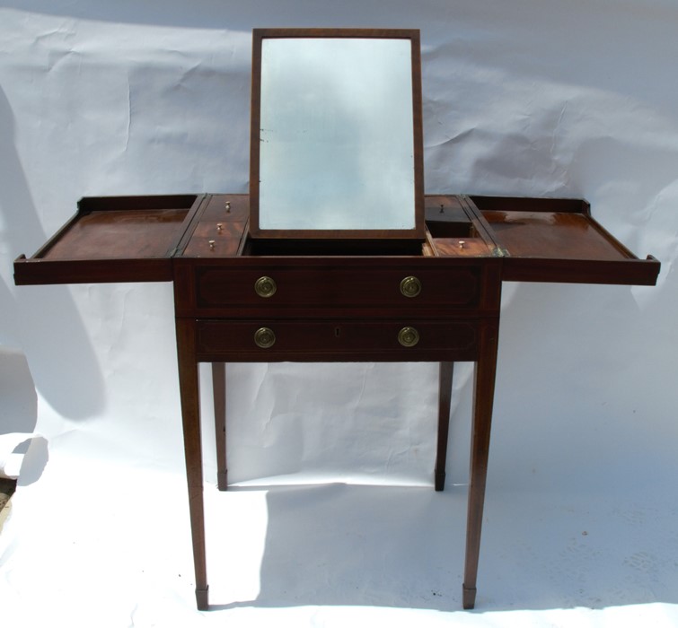 A 19th century mahogany wash stand, the hinged top revealing a mirror and compartments, over one