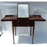 A 19th century mahogany wash stand, the hinged top revealing a mirror and compartments, over one