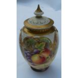 A Royal Worcester quarter lobed covered vase, decorated half round with fruit by Dare, shape