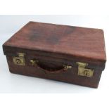 A Harrods London leather travelling case, with material lined interior, gilt initials, 13ins x 18ins