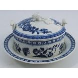 A First Period Worcester covered butter dish and stand, decorated in the Three Flowers pattern,