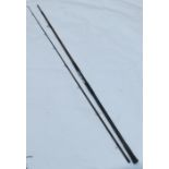 A 12ft 3ins fibreglass sea caster rod, in two sections