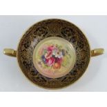 A Royal Worcester two handled bowl, the interior decorated with a floral spray by E Phillips, to a