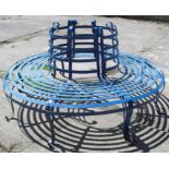 A painted garden circular wrought iron bench, diameter 68ins, centre diameter 26.5ins