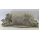 A concrete model, of a greyhound chasing a rabbit, height 11ins, length 29ins