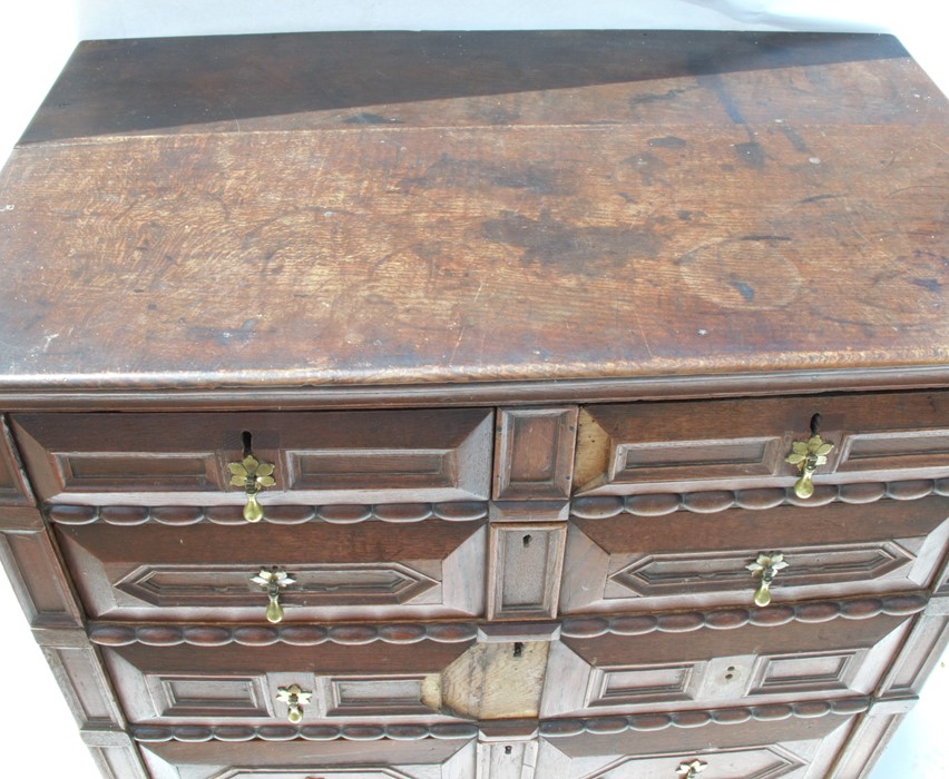 An Antique oak moulded front chest of drawers, fitted with two short over three long drawers, raised - Image 2 of 2
