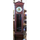 An Edwardian mahogany long case clock, with circular dial and glazed door with Westminster chimes,